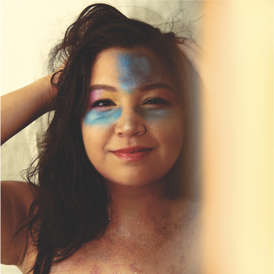 girl with glitter make up just waking up