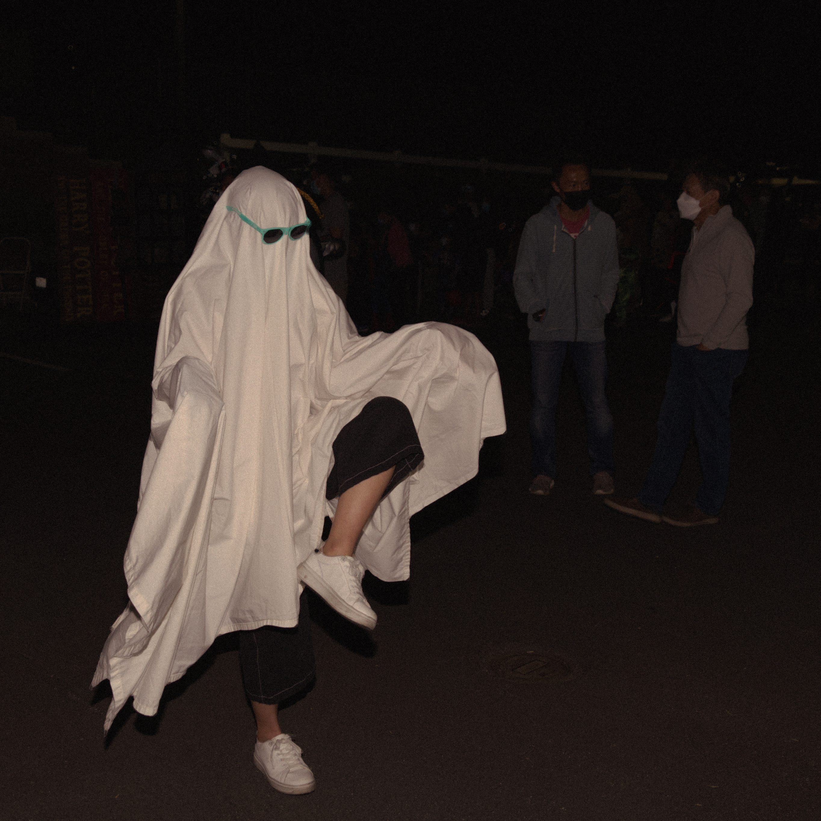 person dressed up as a ghost and dancing